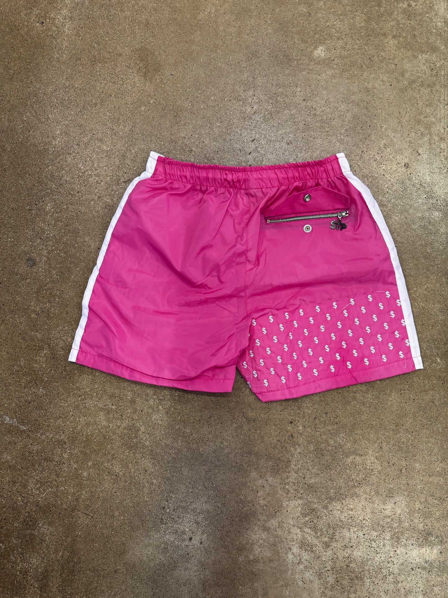 Pantalones cortos cortavientos Signature en color rosa y blanco