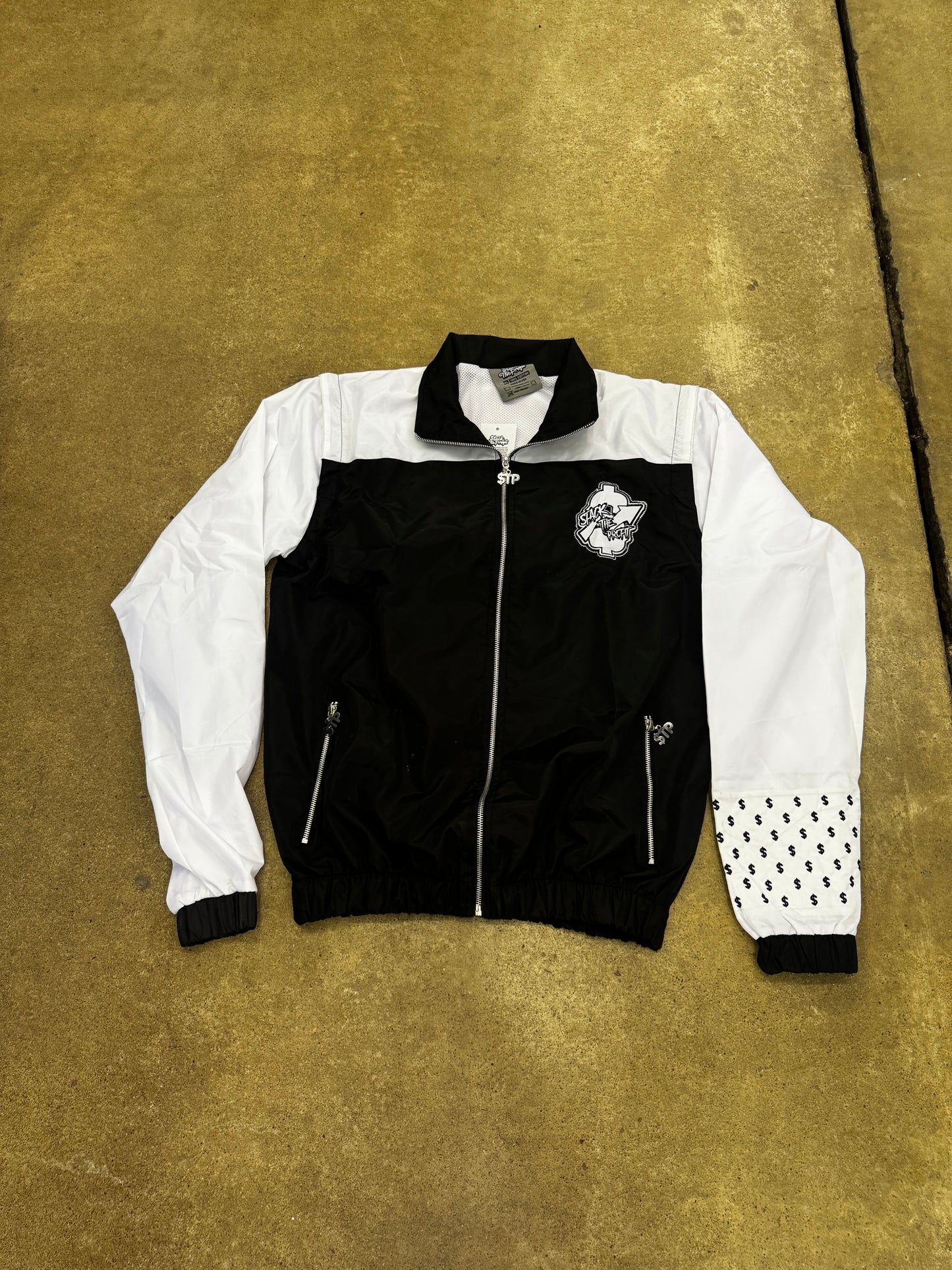 Chaqueta cortavientos Signature en blanco y negro